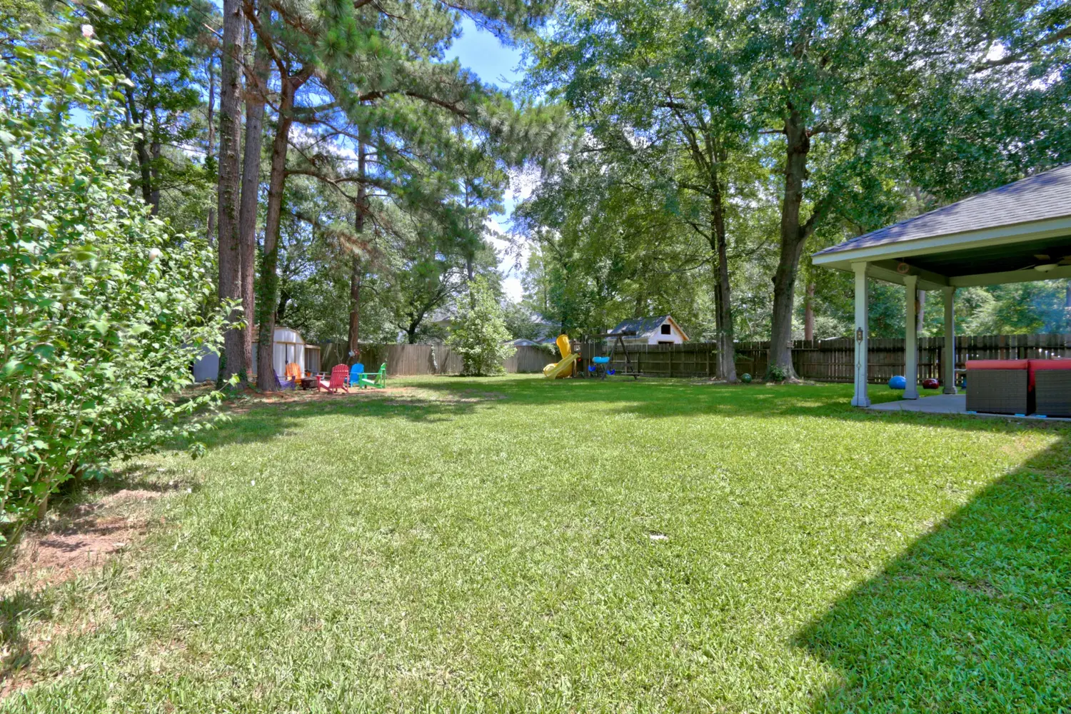 Large backyard and covered patio at 7110 Hayden Drive