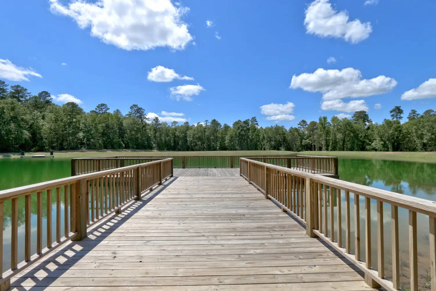 Community lake and dock at Texas Grand Ranch